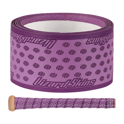 The Lizard Skins DSP Ultra Solid 1.1mm Bat Grip in purple, featuring black diagonal lines and the Lizard Skins logo, is shown both rolled up and wrapped around a bat handle.