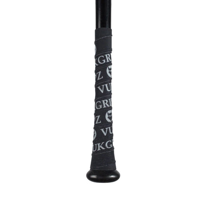 Close-up of the handle of a black bat wrapped with VukGripz Bat Grip Tape by VukGripz, featuring repeating white text and logo patterns for optimum grip.