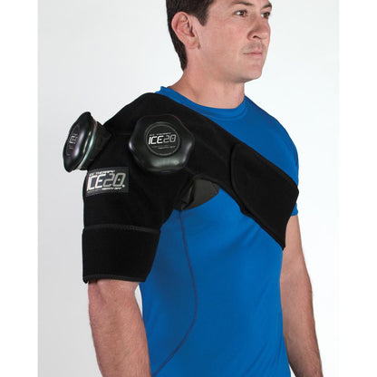 A man in a blue shirt demonstrates the Bownet ICE20 Double Shoulder Ice Compression Wrap (ICE-Dbl-Shoulder) with two refillable ice bags on his left shoulder and upper arm for effective ice therapy.