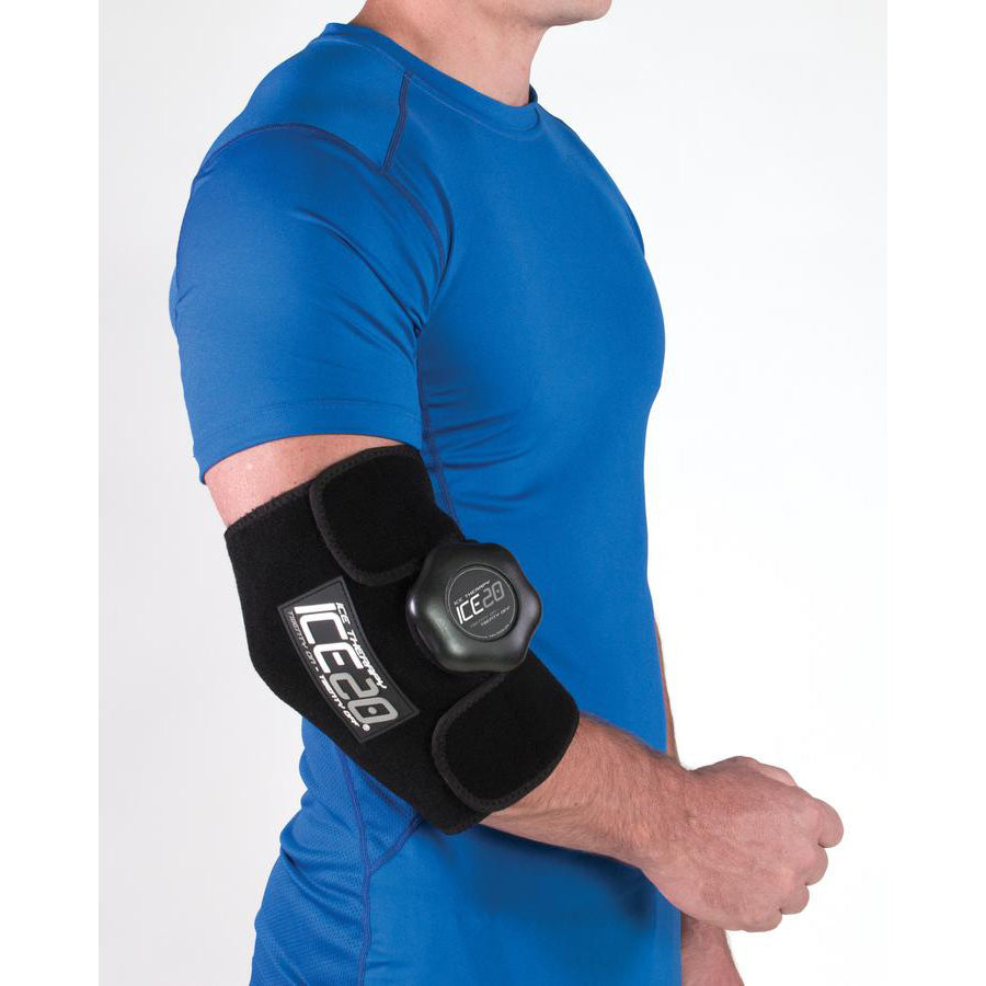 A person in a fitted blue athletic shirt wears the Bownet ICE20 Elbow / Small Knee Ice Compression Wrap (ICE-ELBOW-SM KNEE) with a cold therapy pack on their right elbow. The arm is slightly bent against a plain white background.