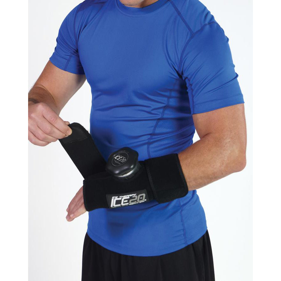 A person in a blue shirt wraps a Bownet ICE20 Elbow / Small Knee Ice Compression Wrap (ICE-ELBOW-SM KNEE) around their elbow, showing its use for injury relief or recovery.