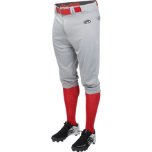 A mannequin wears Rawlings Adult Launch Knicker Baseball Pants (LNCHKP) in gray with a visible Rawlings logo, paired with a red belt, red knee-high socks, and black cleats featuring white accents.