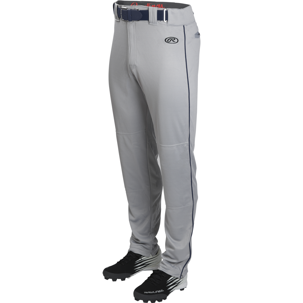 A pair of Rawlings Youth Launch Semi-Relaxed Baseball Pants with navy piping and waistband, shown with black cleats on a white background.
