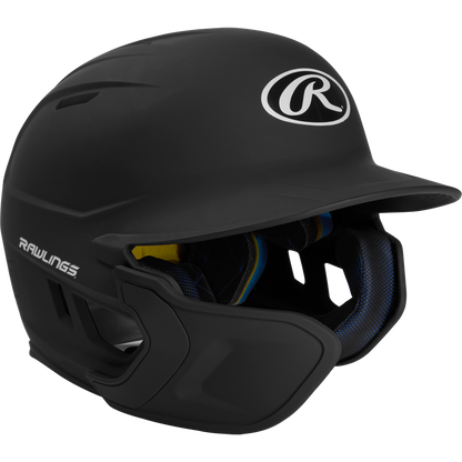 A black Rawlings Mach Matte Batting Helmet with EXT flap (MACHEXT), featuring a protective face guard, padded interior, and Rawlings logos on the front and side, displayed on a plain white background.