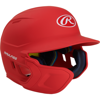 A bright red Rawlings Mach Matte Batting Helmet with EXT Flap (MACHEXT), featuring a protective face guard, blue interior padding, and the Rawlings logo on the front and side.