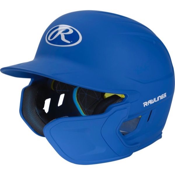 A blue Rawlings Mach Matte Batting Helmet with EXT Flap (MACHEXT) features protective ear and jaw guards, black interior padding, and a white Rawlings logo on the front and side.
