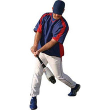 A baseball player in a blue and red jersey, white pants, and blue shoes uses the Markwort RBI Pro Swing weighted bat swing trainer to perfect his form before batting practice.