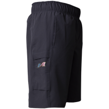 Miken Men's Slowpitch Shorts: MSPSM20 by Miken are navy blue poly-spandex athletic shorts with an elastic waistband and a side cargo pocket featuring a small embroidered American flag and stylized M logo.