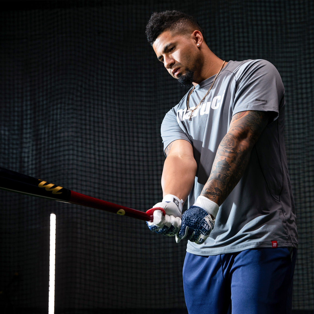 A man holding a Marucci GLEY25 Gleyber Torres Pro Model Maple Wood Bat (MVE2GLEY25-CH/BK) by Marucci.
