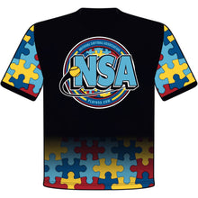 The DSG Apparel National Softball Association NSA Autism Awareness Sublimated Short Sleeve Shirt features a black design with blue, yellow, and red puzzle pieces, a large NSA logo, softball graphic center, and National Softball Association text.