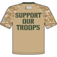 The DSG Apparel National Softball Association NSA Support Our Troops sublimated short sleeve shirt features tan camo, moisture-wicking fabric, green SUPPORT OUR TROOPS back print, NSA logo at neck, US flag on one sleeve, and yellow ribbon on the other.