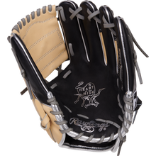 The Rawlings Heart of the Hide 11.5" Baseball Glove (PRONP4-8BCSS) features premium HOH steer-hide leather in black and tan with gray laces, white palm branding, and detailed interior stitching in its open infield design.
