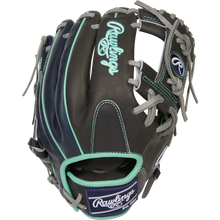 The Rawlings Heart of the Hide R2G 11.5" Baseball Glove (PROR204U-2DS) features a black design with teal and gray accents, white stitching, and a light blue and white embroidered Rawlings logo on the back.