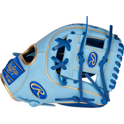 The Rawlings Heart of the Hide R2G ContoUR 11.25" Baseball Glove (PROR312U-2R) features light blue leather, dark blue lacing, gold accents, and blue logos, shown against a white background.