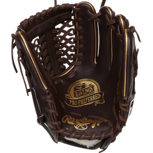 The Rawlings Pro Preferred 11.75" Baseball Glove: PROS205-4MO features dark brown kip leather with tan stitching and laces, plus gold Rawlings logos on the palm and wrist for premium style and performance.