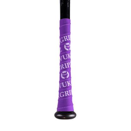 A black baseball bat handle wrapped with VukGripz Bat Grip Tape in purple, featuring repeating white text and the VukGripz logo for optimal grip.