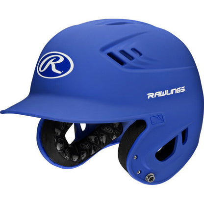 The Rawlings Velo Matte Batting Helmet: R16M features a protective face guard, ventilation holes, and prominent Rawlings branding—ideal for youth baseball players seeking added safety.