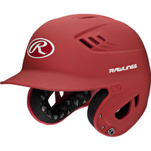 The Rawlings Velo Matte Batting Helmet: R16M is a red youth baseball helmet with a face guard, ventilation holes, visible interior padding, and the Rawlings logo on the front and side.