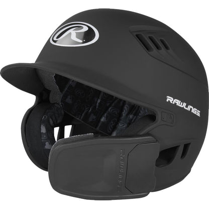 The Rawlings R16 Matte Batting Helmet with Universal Jaw Guard (R6R07) features ear and jaw protection, a matte black finish, ventilation holes, front Rawlings logo, and padded interior lining.
