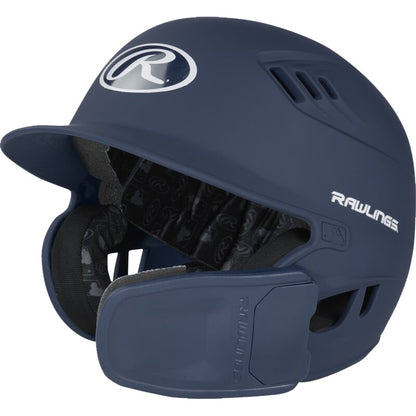 A dark blue Rawlings R16 Matte Batting Helmet (R6R07) with vent holes, a universal jaw guard, a protective face guard, and the Rawlings logo on the front and side.