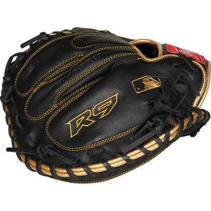 A Rawlings R9 32.5" baseball catcher's mitt (R9CM325BG) in black with gold stitching and accents, featuring the R9 logo and a gold MLB logo near the thumb.