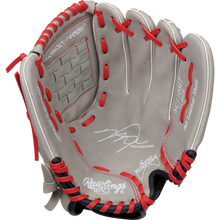 The Rawlings Sure Catch 11" Mike Trout Youth Baseball Glove (SC110MT) is a tan glove with red lacing, a woven basket web, embossed branding, and signature detail inside the palm for authenticity.