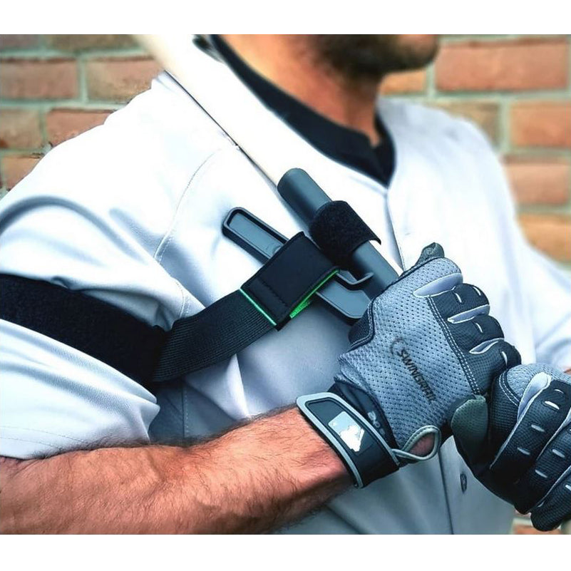 A man wearing gloves holds a bat, using the SWINGRAIL Baseball & Softball Swing Trainer by SWINGRAIL to improve his bat speed and technique.