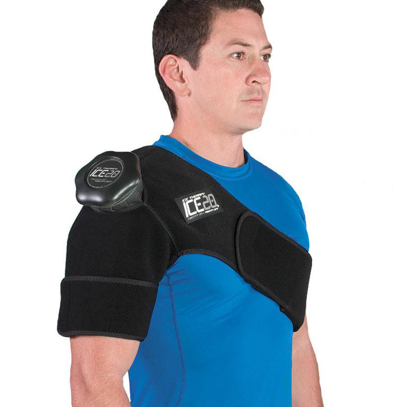 A man in a blue shirt uses the Bownet ICE20 Single Shoulder Ice Compression Wrap (ICE-Shoulder), which features a refillable ice bag and comfortably supports his shoulder, upper arm, chest, and back.
