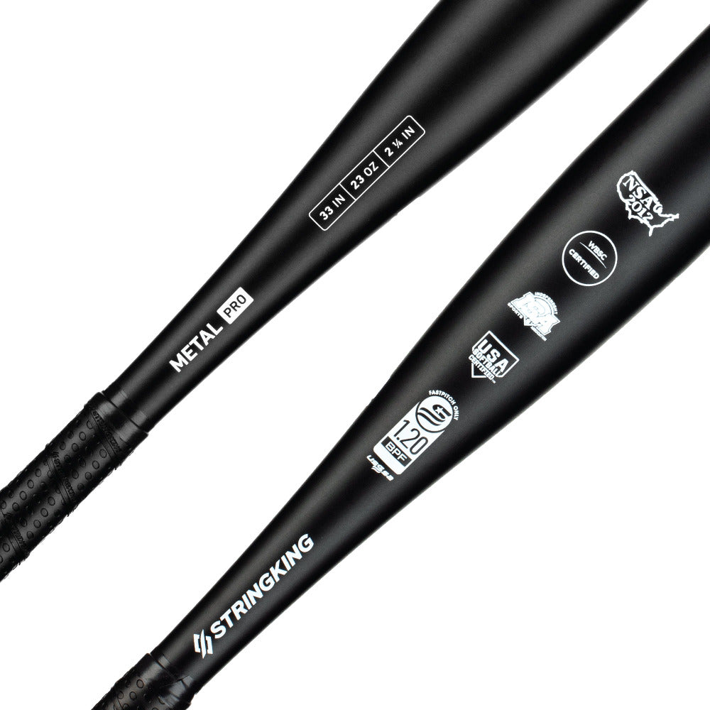 Two black 2022 StringKing Metal Pro (-10) Fastpitch Softball Bats feature white logos, USA Baseball and BBCOR Certified .50 stamps, aluminum alloy construction, and textured grips for balanced swing weight.