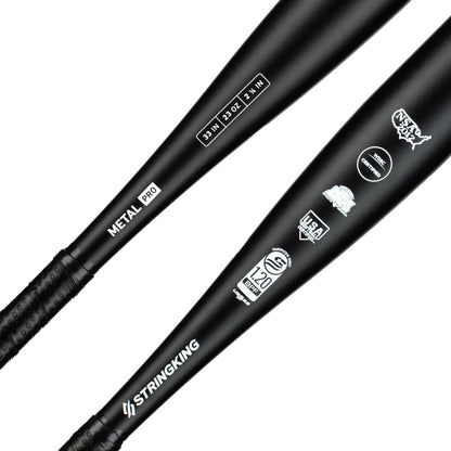 Two black 2022 StringKing Metal Pro (-10) Fastpitch Softball Bats feature white logos, USA Baseball and BBCOR Certified .50 stamps, aluminum alloy construction, and textured grips for balanced swing weight.