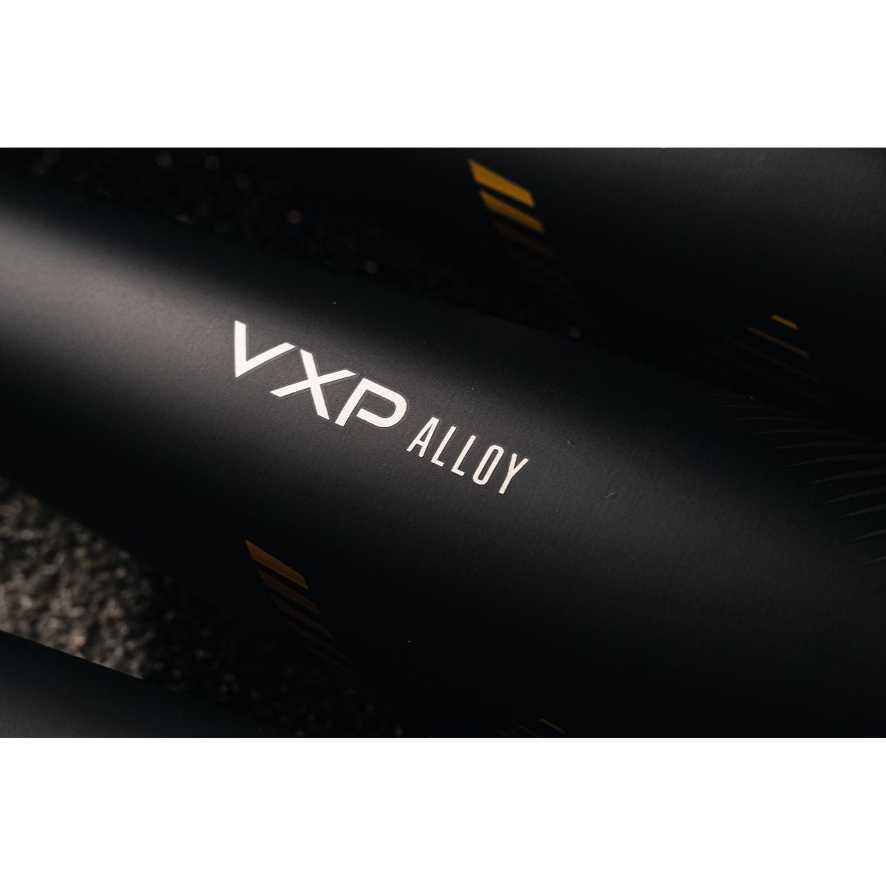 Close-up of the matte black Victus 2022 Vandal 2 (-8) USSSA Senior League baseball bat, featuring "VXP ALLOY" in white on its hybrid aluminum barrel with subtle yellow lines in the background.