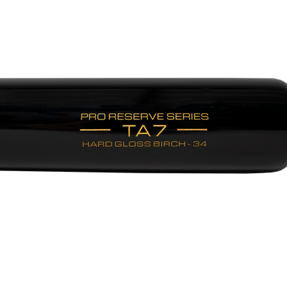 Close-up of a Victus TA7 Tim Anderson Pro Reserve Birch Wood Bat (VRWBTA7-NT/BK) in sleek black, showcasing Big League-grade quality and gold text: PRO RESERVE SERIES TA7 HARD GLOSS BIRCH - 34 on the barrel.