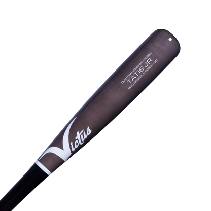A close-up of the black and gray Victus TATIS JR Youth Pro Reserve Birch Wood Bat (VYRWBTATISJR) shows white script branding and model details printed near the barrel for a balanced feel.