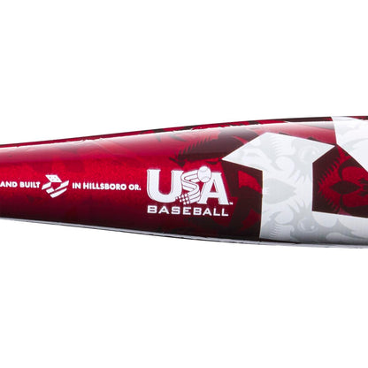 Close-up of the red and white 2023 DeMarini Voodoo One -5 USA Baseball Bat (WBD2361010), with logo and “designed and built in Hillsboro, Oregon” text visible. Subtle patterns highlight its X14 Alloy Barrel.