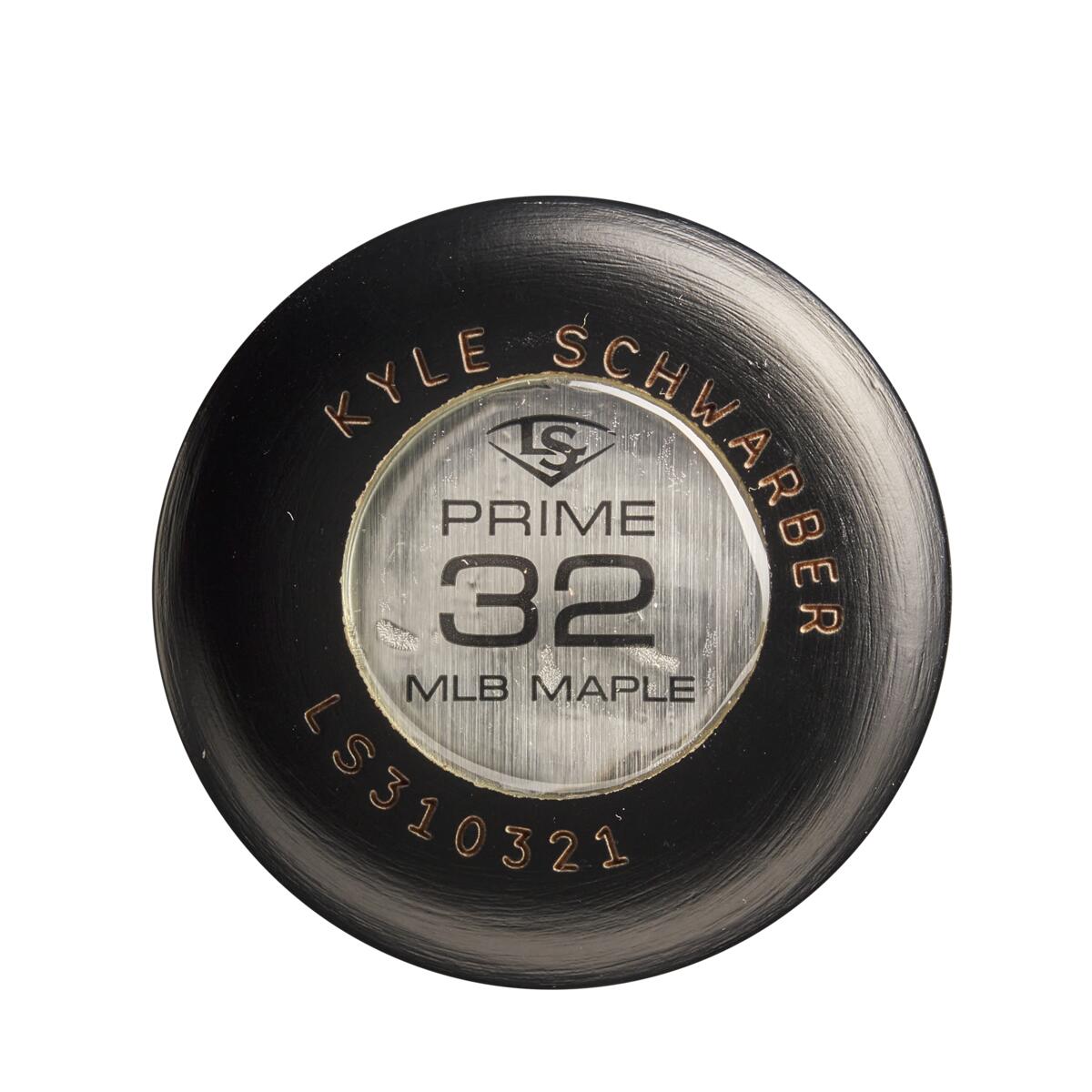 Close-up of the knob end of a black Louisville Slugger MLB Prime Signature Series KS12 Kyle Schwarber GM Maple Wood Baseball Bat (WBL2679010) showing player details and branding on a metallic label.
