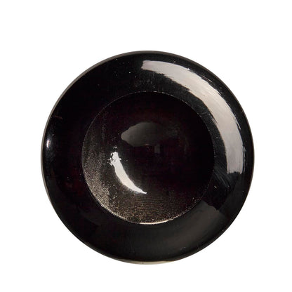 A shiny, black, round bowl is viewed from above against a white background. Its reflective surface gleams like the polished finish of a Louisville Slugger Youth Prime CY22 Christian Yelich Maple Wood Baseball Bat. The bowl is empty.