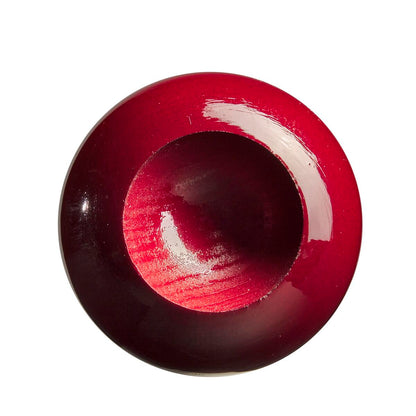 A glossy, deep red, round wooden bowl with a smooth indentation—evoking the rich maple finish of the Louisville Slugger Youth Prime VG27 Vladimir Guerrero Jr. Bat by Louisville Slugger—displayed on a white background.