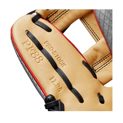 Close-up of the Wilson A2000 PF88SS 11.25" SuperSnakeSkin Baseball Glove (WBW1009811125) in tan leather, showing embossed PRO-STOCK, P.F.88, and 11.25 text with black laces, red trim, and Pedroia Fit technology from Wilson.