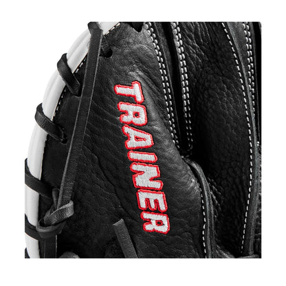 Close-up of the Wilson 27.5" Infield Pancake Training Mitt (WBW100997275), a black leather Wilson trainer featuring white stitching and "TRAINER" embroidered in red and white on the surface.