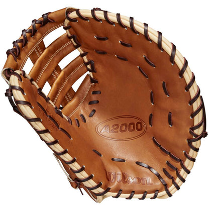 The Wilson A2000 AC4 12.5" Amanda Chidester GM fastpitch first base mitt (WBW101017125) features brown Pro Stock leather, black laces, and cream trim, shown from the inside with visible palm and finger slots.