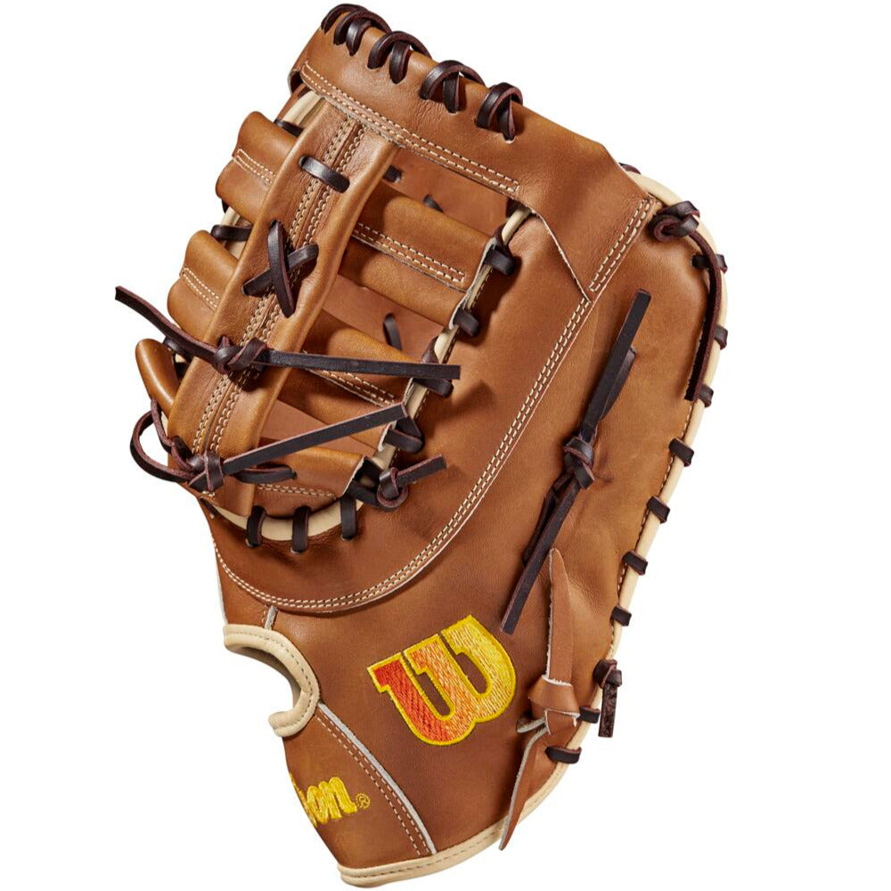 The Wilson A2000 AC4 12.5" Amanda Chidester GM Fastpitch First Base Mitt (WBW101017125) features brown Pro Stock leather, dark brown laces, and a yellow embroidered W logo, inspired by Amanda Chidester's glove design.