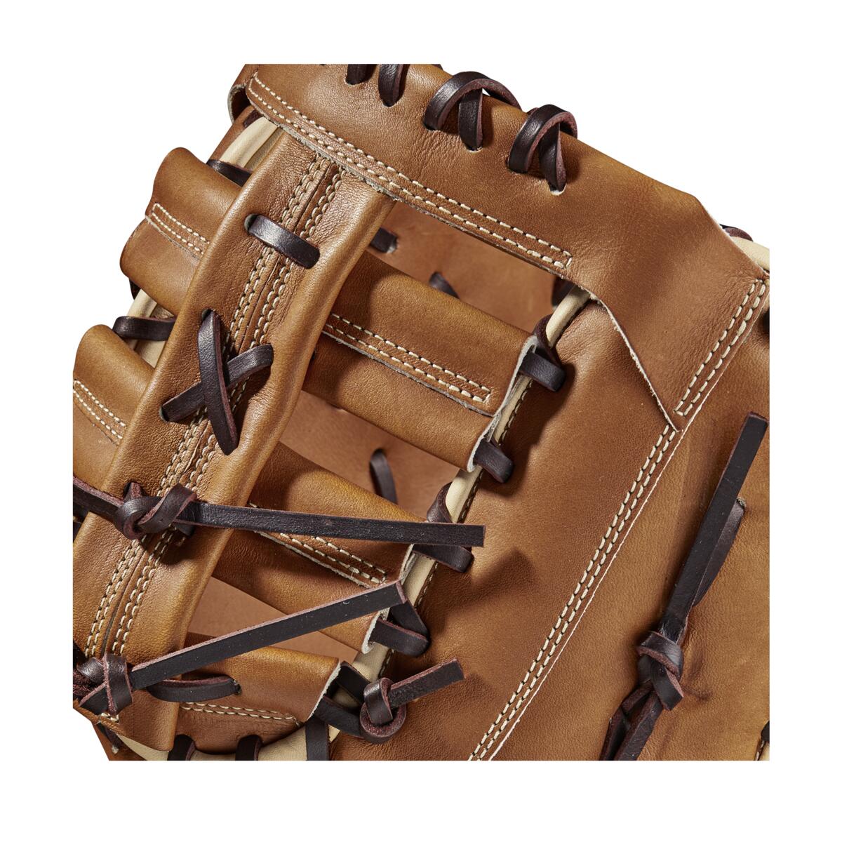 Close-up of the Wilson A2000 AC4 12.5" Amanda Chidester GM Fastpitch First Base Mitt (WBW101017125) in brown Pro Stock leather with black lacing and white stitching, highlighting the detailed craftsmanship and texture.