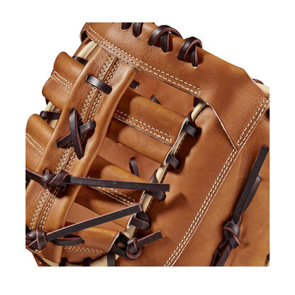 Close-up of the Wilson A2000 AC4 12.5" Amanda Chidester GM Fastpitch First Base Mitt (WBW101017125) in brown Pro Stock leather with black lacing and white stitching, highlighting the detailed craftsmanship and texture.