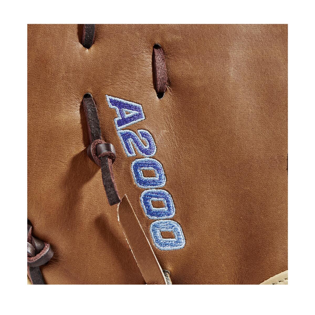 Close-up of the Wilson A2000 AC4 12.5" Amanda Chidester GM Fastpitch First Base Mitt, showcasing brown Pro Stock leather, dark brown laces, and "A2000" embroidered in blue and white stitching.
