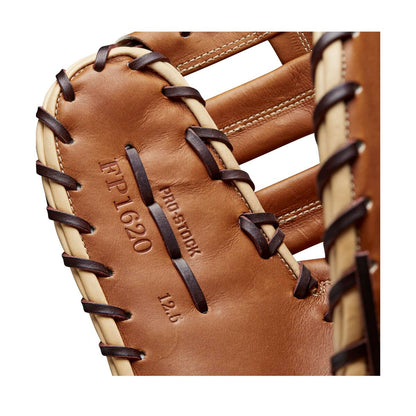 Close-up of the Wilson A2000 AC4 12.5" Amanda Chidester GM Fastpitch First Base Mitt (WBW101017125), made of brown Pro Stock leather with dark laces and “PRO STOCK, FP-1620, 12.5” stamped on the glove—modeled after Amanda Chidester’s design.