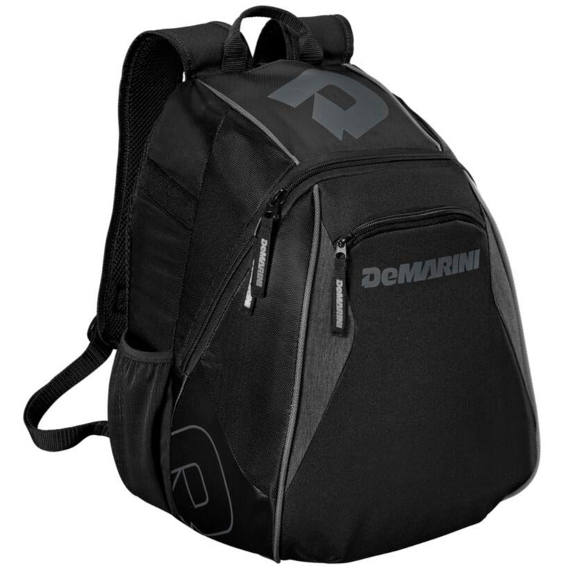 The DeMarini Voodoo Junior Backpack (WTD9106) is a black youth baseball bag with multiple zippered compartments, padded shoulder straps, and subtle gray logo accents on the front and side.