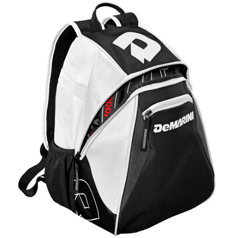 The DeMarini Voodoo Junior Backpack (WTD9106) in black and white features a front zip pocket, side compartments, a main compartment holding a bat, and displays the DeMarini logo prominently on the front and sides.