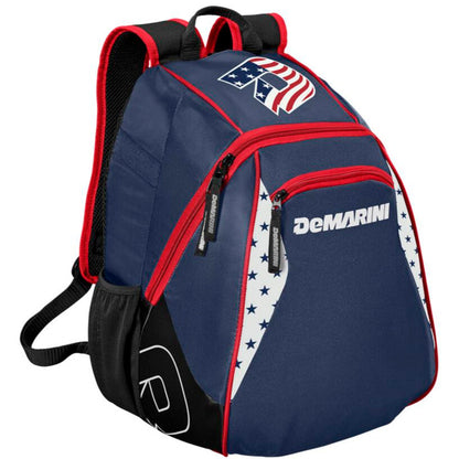 The DeMarini Voodoo Junior Backpack (WTD9106) features navy blue with red zippers, black bottom, white side panels with blue stars, an American flag patch on top, and red-trimmed padded shoulder straps. Ideal for young baseball players.