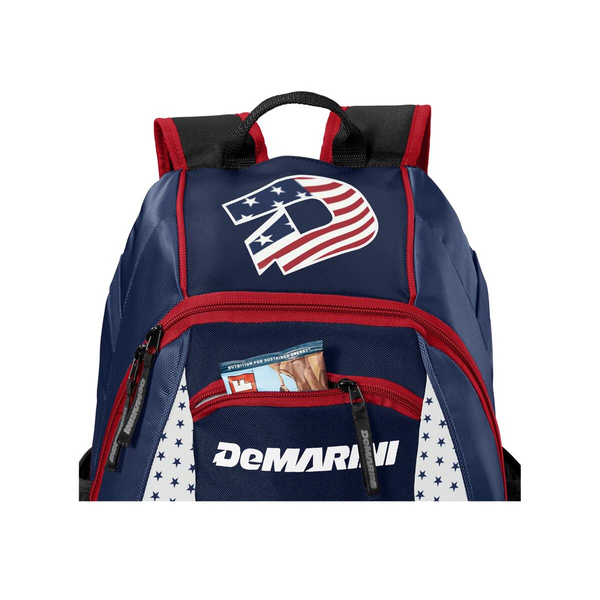 The DeMarini Voodoo Junior Backpack (WTD9106) features a blue and red design with a large American flag D logo and an open front pocket showing Big League Chew gum—ideal as a youth baseball backpack.