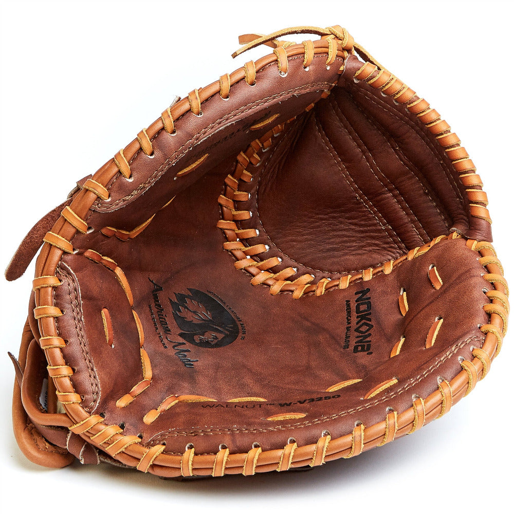 The Nokona Walnut 32.5" Fastpitch Catcher's Mitt (W-V3250) features brown Walnut Crunch leather, tan laces, and detailed inner pocket stitching, shown from above.